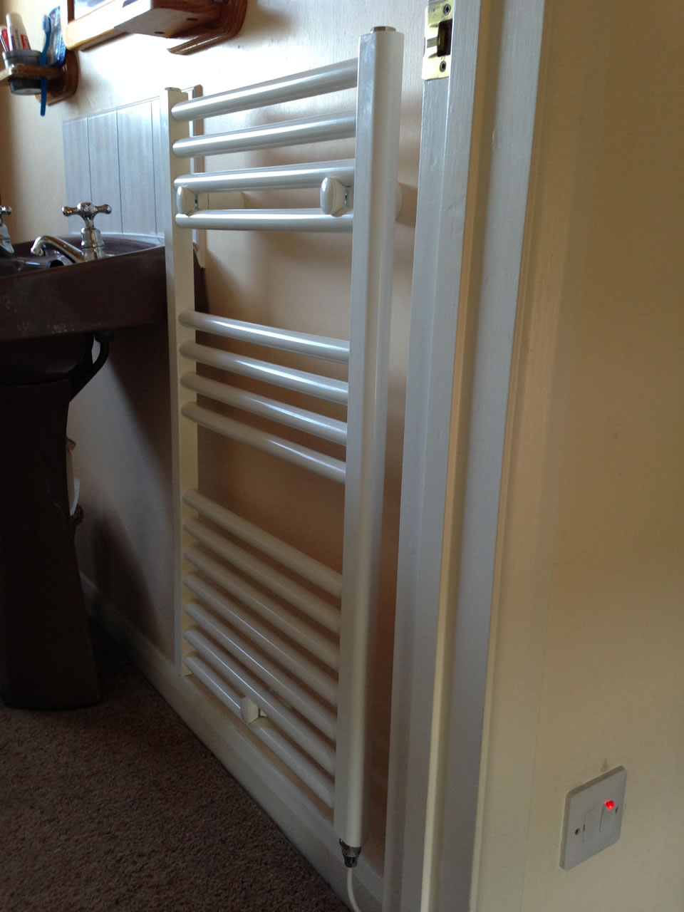 New towel rail with isolator outside bathroom